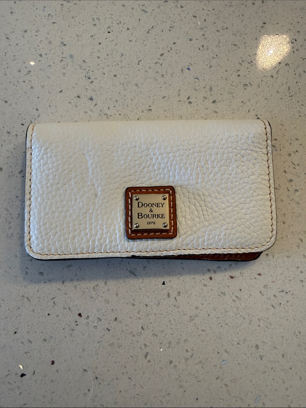 Dooney & Bourke White Pebbled Leather Bifold Wallet with Brown Trim